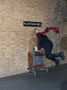 Woman Entering Platform 9 3/4, Kings Cross Station Royalty Free Stock Photo