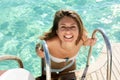 Woman entering pool