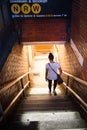 Woman Entering Subway Station in New York City Royalty Free Stock Photo