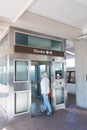 woman enters the elevator to go down to the subway. View from the back Royalty Free Stock Photo