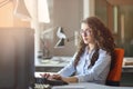 Woman entrepreneur busy with her work in office. Royalty Free Stock Photo