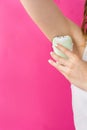 Woman epilates her armpit with an epilator Royalty Free Stock Photo