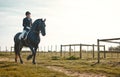 Woman, equestrian, horse ride and mockup in nature in countryside and grass field. Animal training, young jockey and