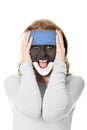 Woman with Estonia flag on face.