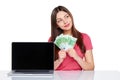 Woman with euro cash showing blank laptop screen Royalty Free Stock Photo