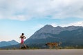 A Woman On An Evening Jog With A Dog