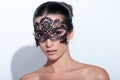 Woman with evening smokey makeup and black lace mask Royalty Free Stock Photo