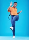 Woman, excited and leg up to celebrate in studio for achievement, promotion or sale deal. Portrait of African person on