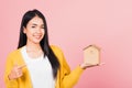 Woman excited smiling holding house model on hand Royalty Free Stock Photo