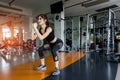 Woman exercise doing squat workout at gym fitness Royalty Free Stock Photo