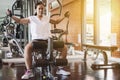 Woman exercise workout on machine in gym.Concept of fitness