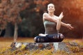 Woman exerciser in autumn park Royalty Free Stock Photo