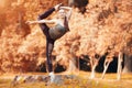 Woman exerciser in autumn park Royalty Free Stock Photo