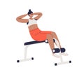 Woman exercising on abdominal bench doing crunches for abs muscles training