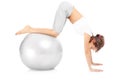 Woman exercising with a ball