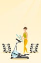 Woman exercising on elliptical trainer.