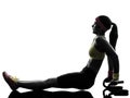 Woman exercising fitness push ups with holders silhouette