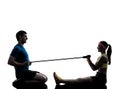 Woman exercising fitness resistance rubber band with man coach Royalty Free Stock Photo