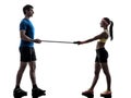 Woman exercising fitness resistance rubber band with man coach Royalty Free Stock Photo