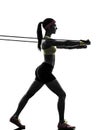 Woman exercising fitness workout resistance bands silhouette Royalty Free Stock Photo