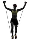 Woman exercising fitness workout resistance bands silhouette Royalty Free Stock Photo