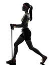 Woman exercising fitness workout resistance bands silhouette Royalty Free Stock Photo