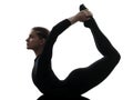 Woman exercising gymnastic yoga urdhva dhanurasana upward bow po