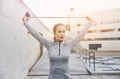 Woman exercising with jump-rope outdoors Royalty Free Stock Photo