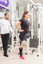 Woman exercising legs on cable machine at gym Royalty Free Stock Photo