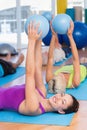 Woman exercising with medicine ball in fitness club Royalty Free Stock Photo