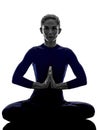 Woman exercising Padmasana lotus pose yoga silhouette Royalty Free Stock Photo