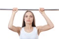 Woman exercising on pull-up bar Royalty Free Stock Photo