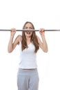 Woman exercising on pull-up bar Royalty Free Stock Photo