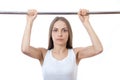 Woman exercising on pull-up bar Royalty Free Stock Photo