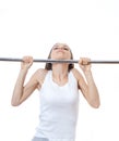 Woman exercising on pull-up bar Royalty Free Stock Photo