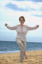 Woman exercising at sea beach Royalty Free Stock Photo