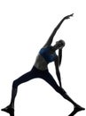 Woman exercising stretching triangle pose yoga Royalty Free Stock Photo