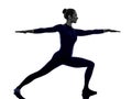 Woman exercising Virbhadrasana II warrior pose yoga silhouette