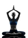 Woman exercising yoga meditating sitting hands joined