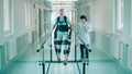A woman in the exosuit is doing physiotherapy with a doctor