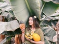 Woman with exotic food in banana leaves