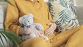 Woman expecting baby. Pregnant girl hugging belly and teddy bear toy resting, awaiting the child birth. Family planning Royalty Free Stock Photo