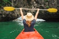 Woman explore Ha Long Bay on kayak Royalty Free Stock Photo