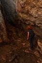 Woman explorer in a cave