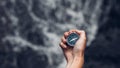 Woman Explorer Searching Direction With Compass In Waterfalls, Point Of View Shot with copy-space