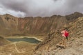 Woman explorer takes photos of the great volcanic landscape of Nevado de Toluca