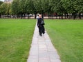 Woman in an extravagant black skirt in Paris