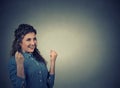 Woman exults pumping fists celebrates success. Positive human emotions Royalty Free Stock Photo