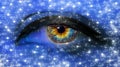 Woman eye close-up macro with long eyelashes and professional blue make-up with stars in blue neon light