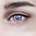 Woman eye and cosmic space. Contact lenses concept. Royalty Free Stock Photo